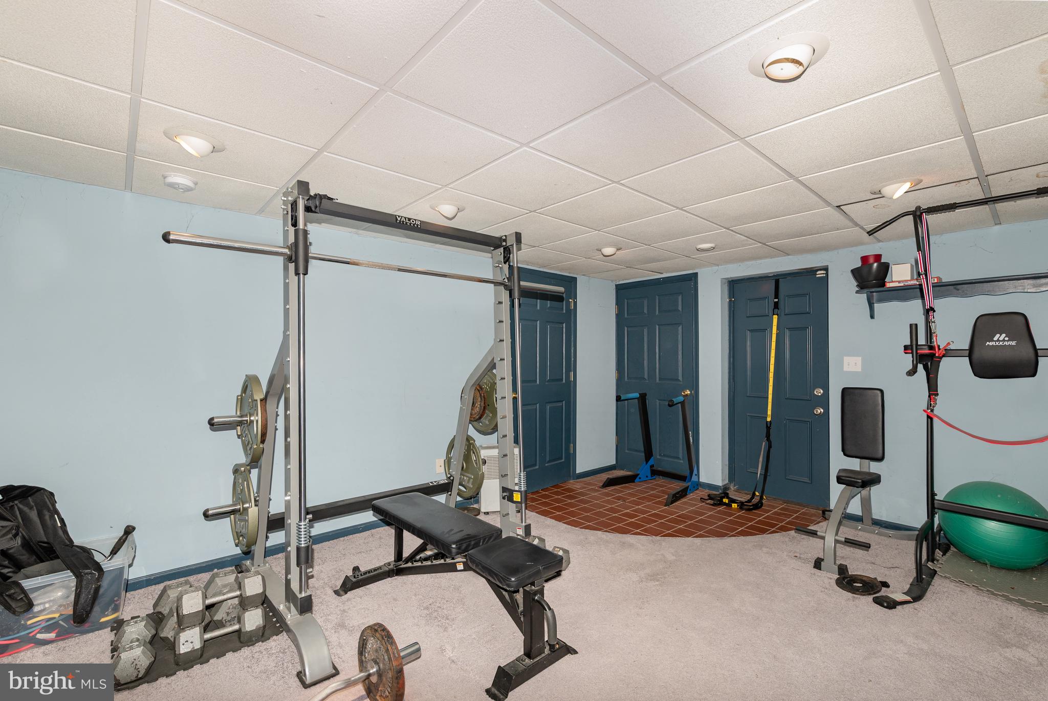 5214 Forge Road Perry Hall, MD 21128 - Photo 26 of 35 a room with gym equipment and mirror
