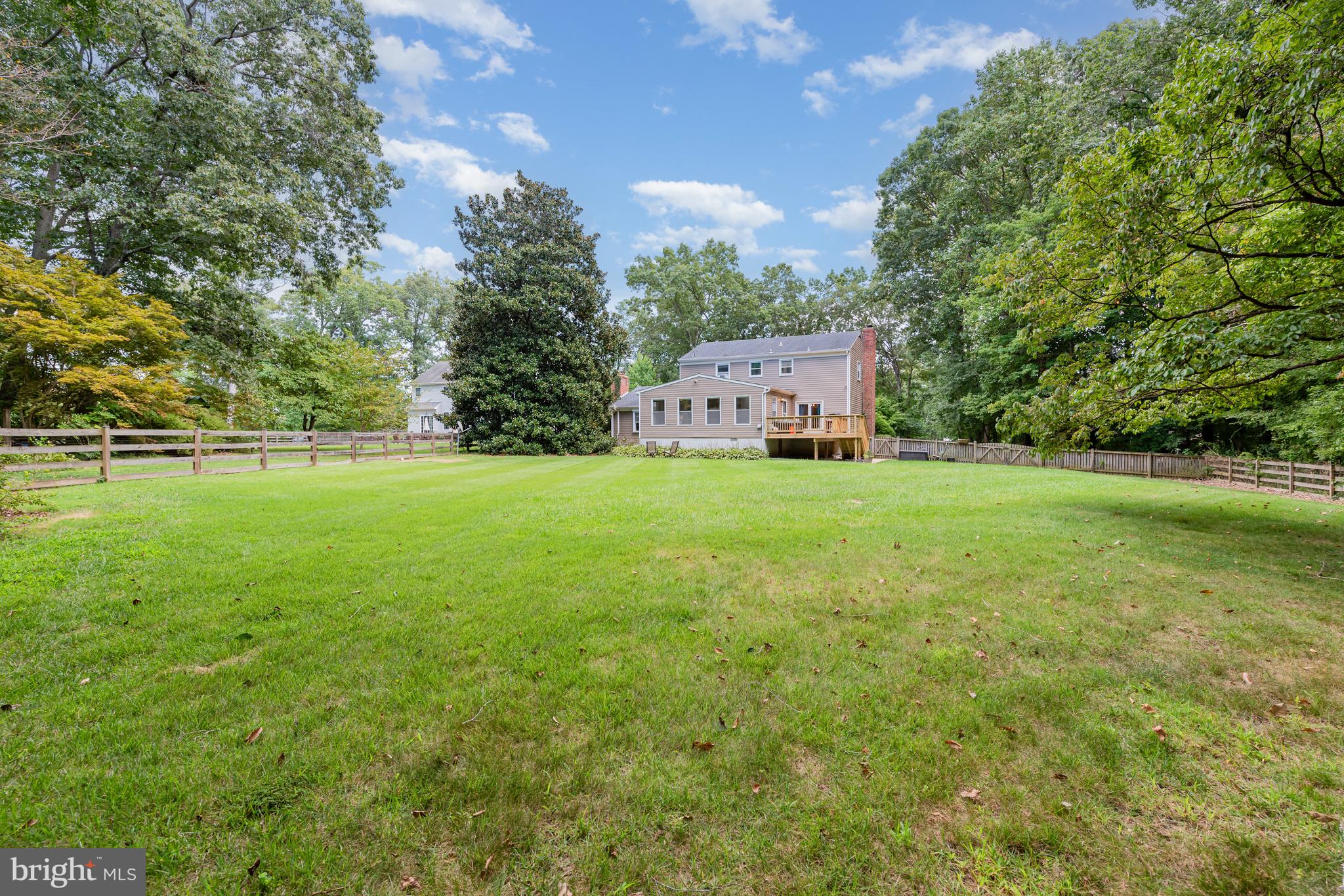 5214 Forge Road Perry Hall, MD 21128 - Photo 31 of 35 a backyard of a house with lots of green space and fountain
