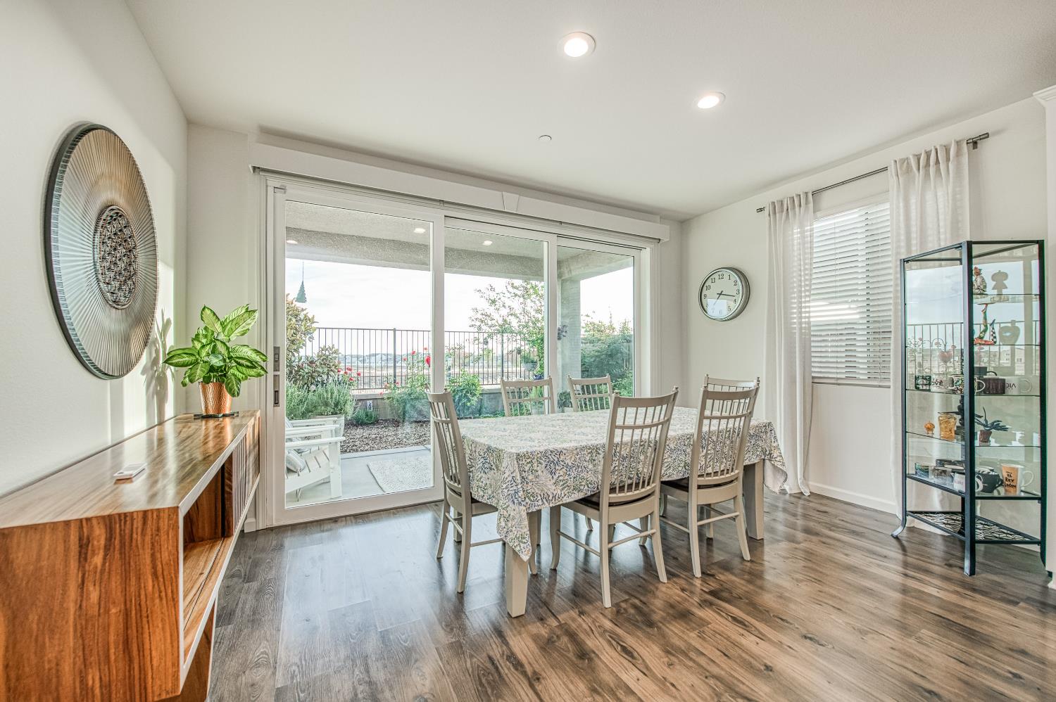 4284 Hillside Road Madera, CA 93636 - Photo 17 of 83 a view of a dining room with furniture window and wooden floor