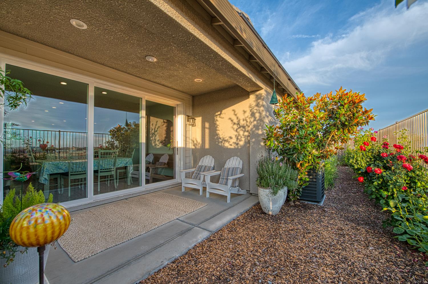4284 Hillside Road Madera, CA 93636 - Photo 25 of 83 a balcony with chairs and potted plants