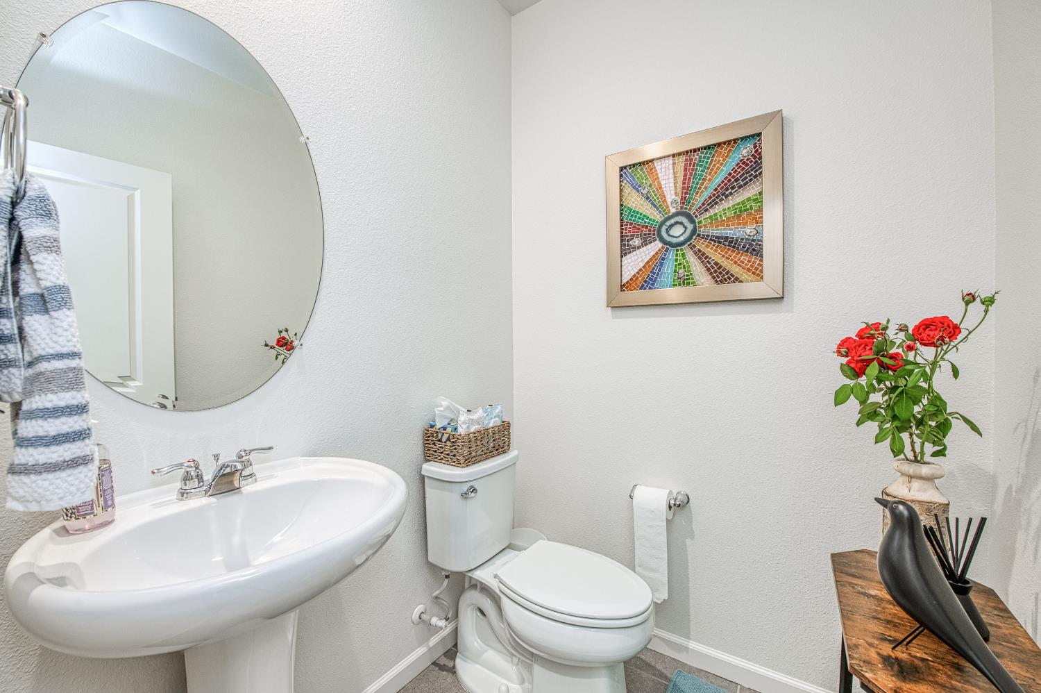 4284 Hillside Road Madera, CA 93636 - Photo 27 of 83 a bathroom with a toilet a sink and a mirror