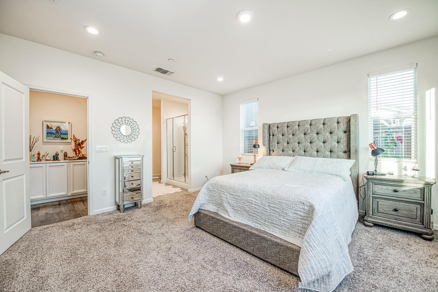 4284 Hillside Road Madera, CA 93636 - Photo 29 of 83 a bedroom with a bed and a large window