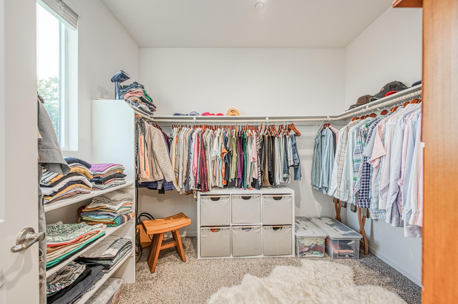 4284 Hillside Road Madera, CA 93636 - Photo 33 of 83 a view of walk in closet with clothes and shoes