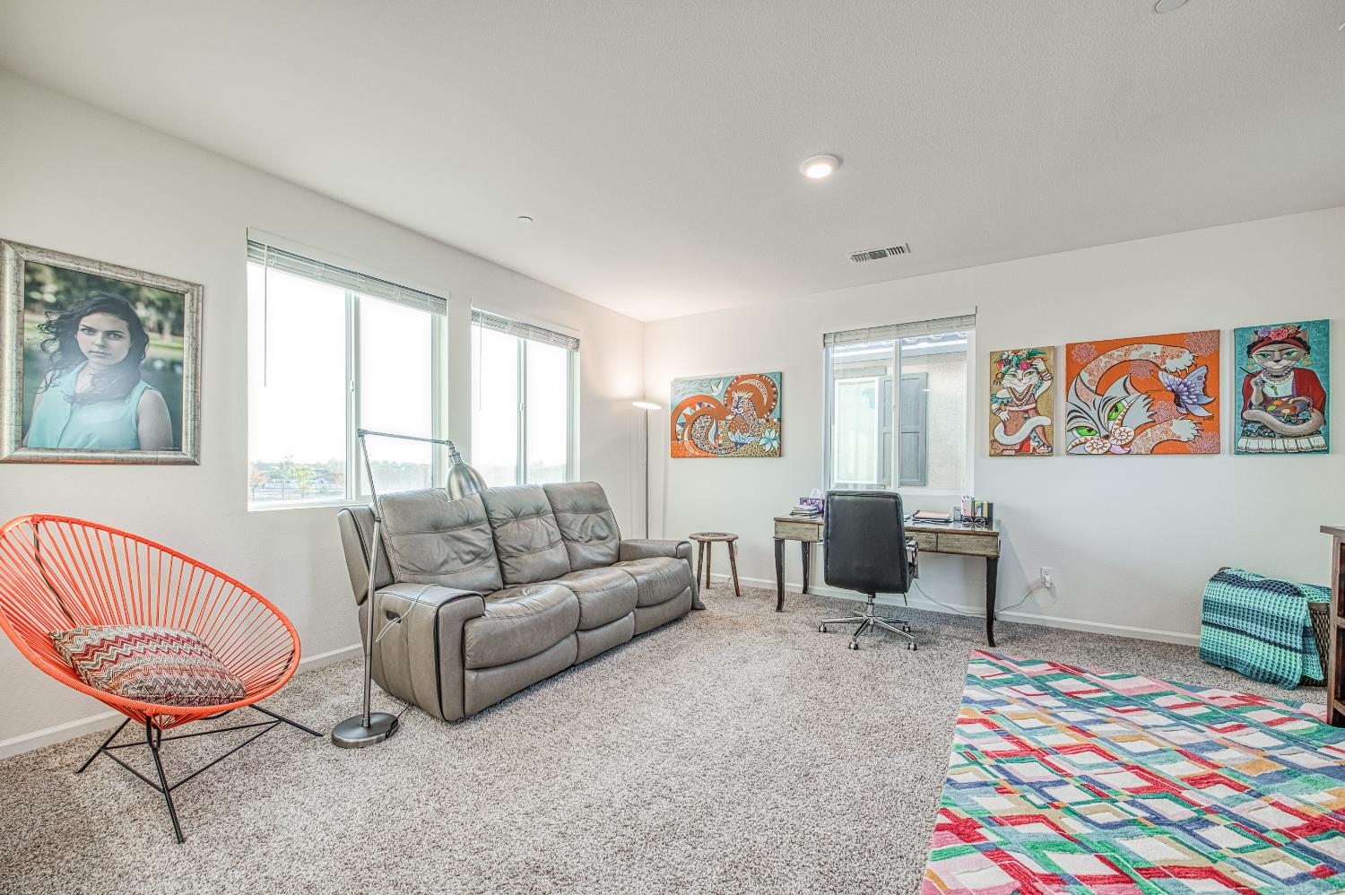 4284 Hillside Road Madera, CA 93636 - Photo 37 of 83 a living room with furniture a rug and a window