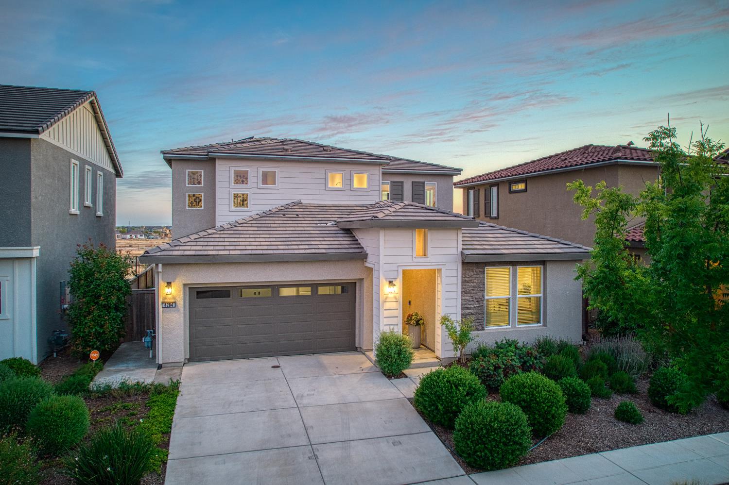 4284 Hillside Road Madera, CA 93636 - Photo 50 of 83 a front view of a house with a yard and garage
