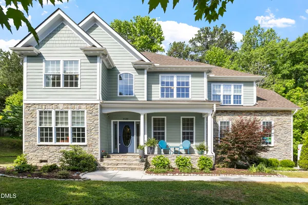 front view of a house that has a yard