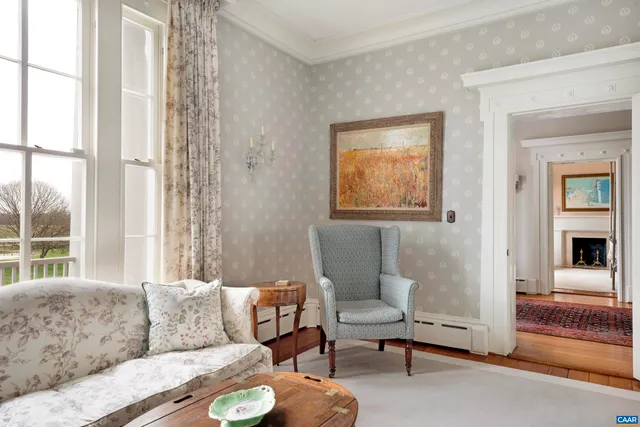 a bedroom with furniture and a fireplace