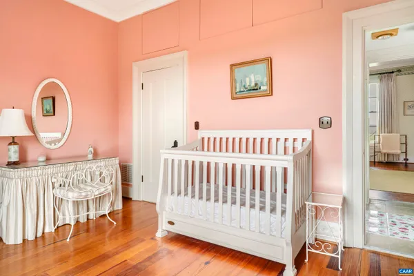 a view of a swimming pool and lounge chairs in back yard