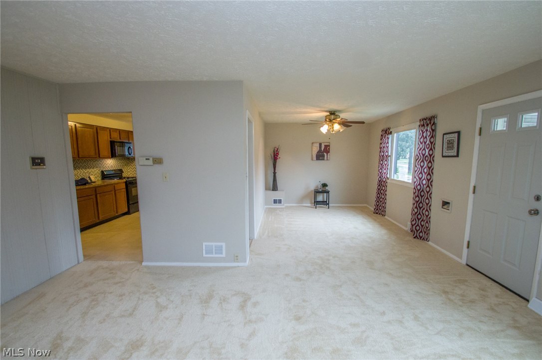 10571 Snow Road Parma Heights, OH 44130 - Photo 4 of 25 Living room and dining room 2