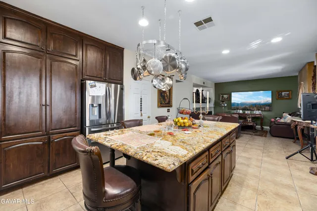 a kitchen with a table and chairs in it