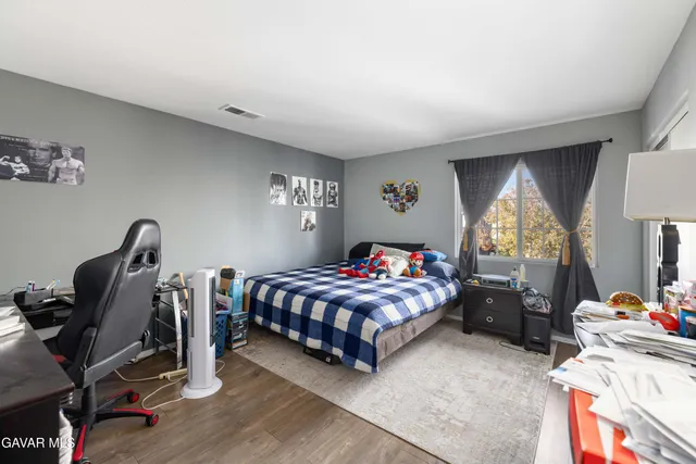 a bedroom with bed and a window