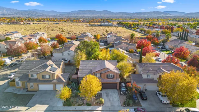 a view of residential houses with outdoor space and ocean view