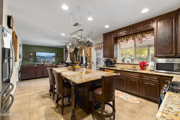 a large kitchen with a table and chairs