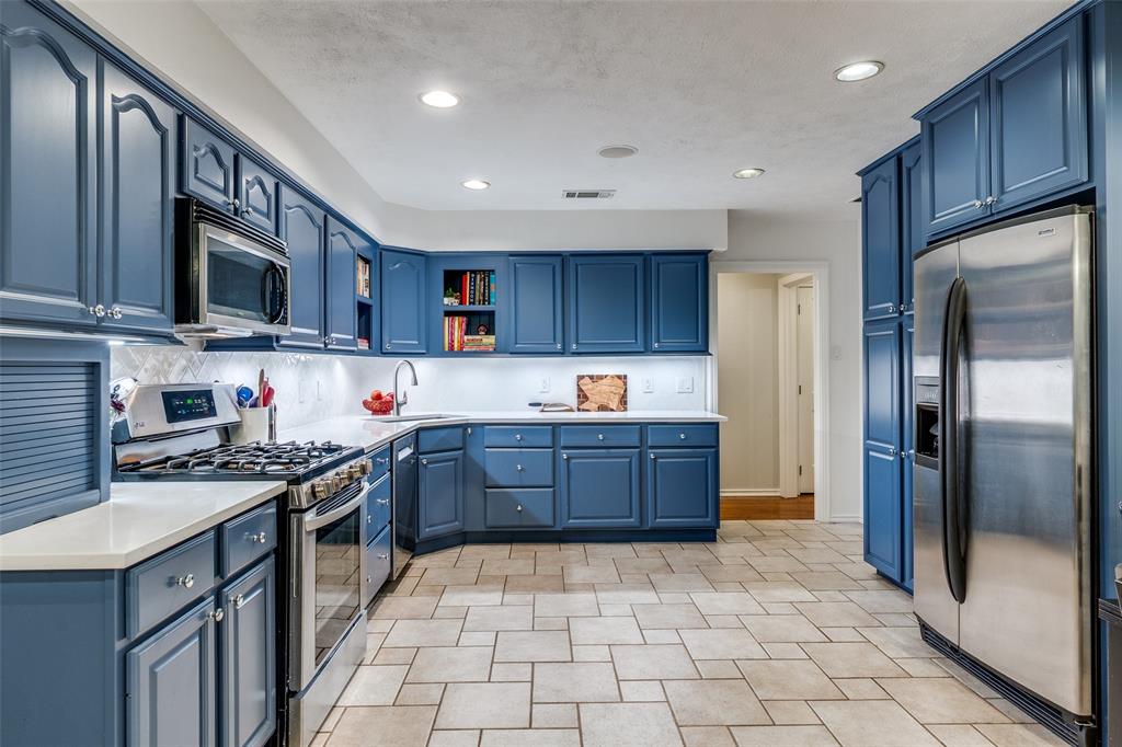 4159 Clover Lane Dallas, TX 75220 - Photo 8 of 25 Kitchen with appliances with stainless steel finishes, blue cabinetry, and recessed lighting