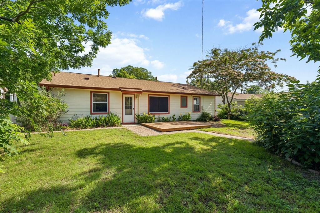 1822 Finley Road Irving, TX 75062 - Photo 4 of 38 a view of a house with a patio and a yard