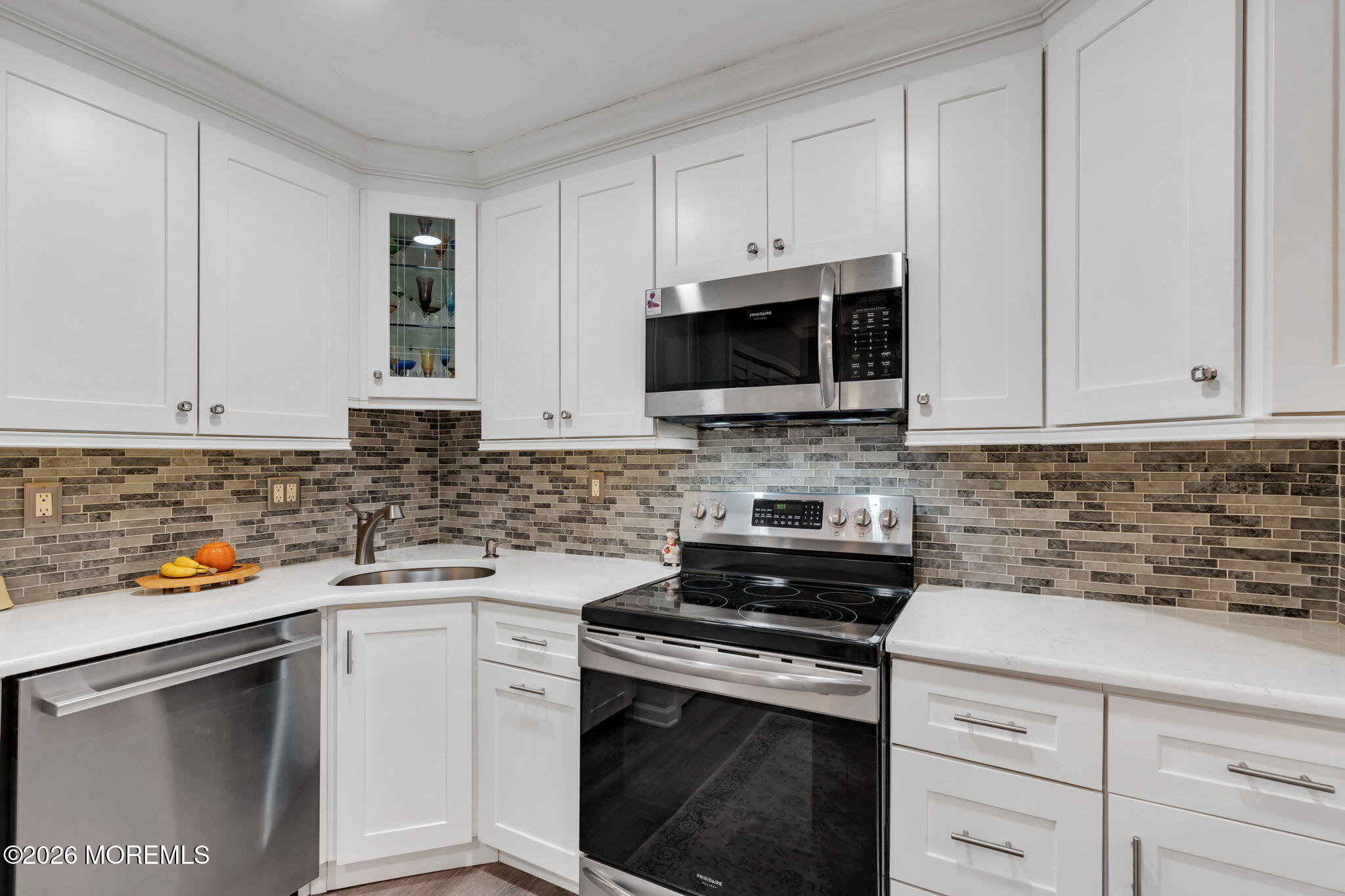 8 Manchester Court Red Bank, NJ 07701 - Photo 13 of 20 a kitchen with white cabinets and stainless steel appliances