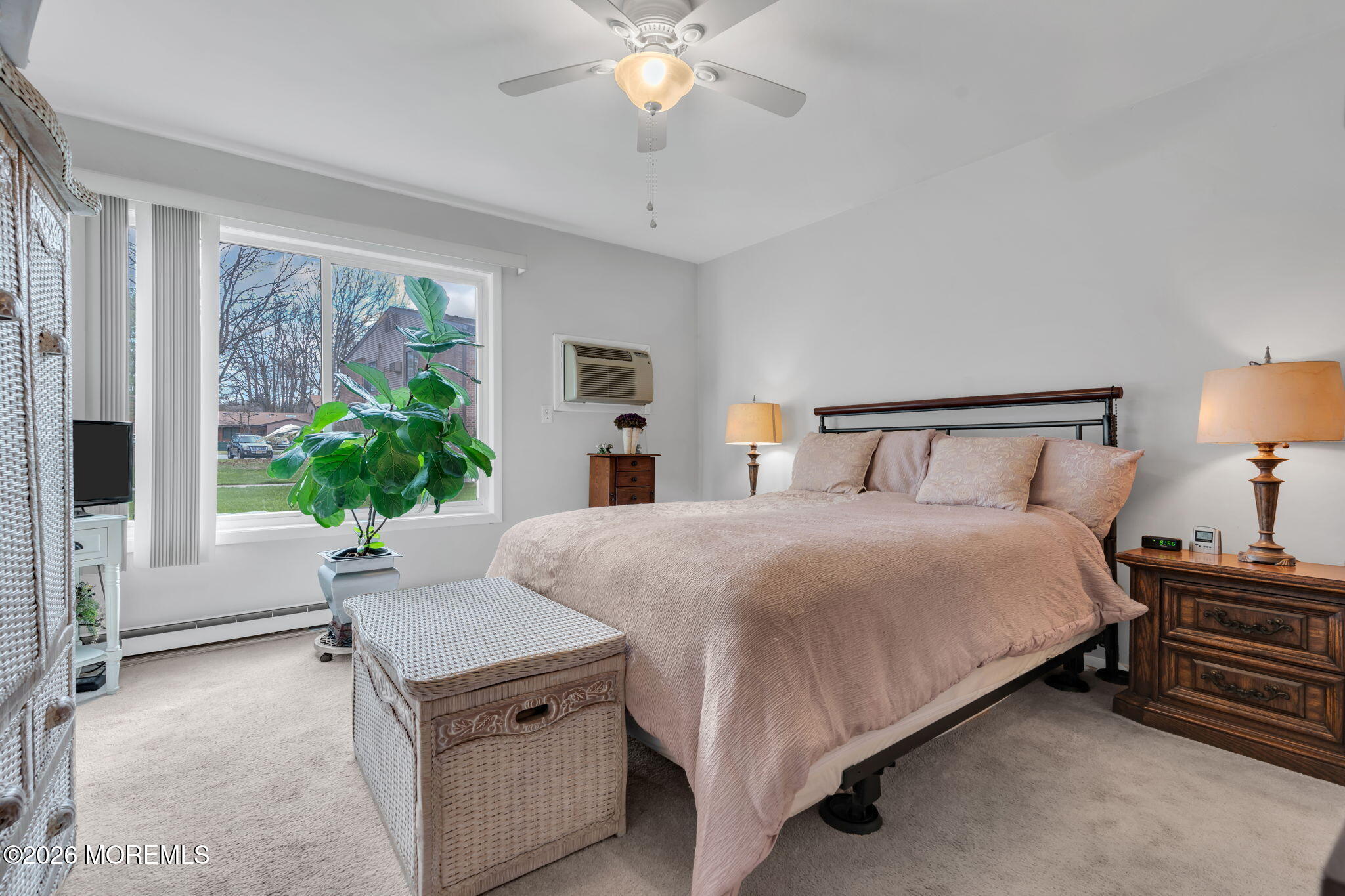 8 Manchester Court Red Bank, NJ 07701 - Photo 17 of 20 a bedroom with a bed and a chandelier
