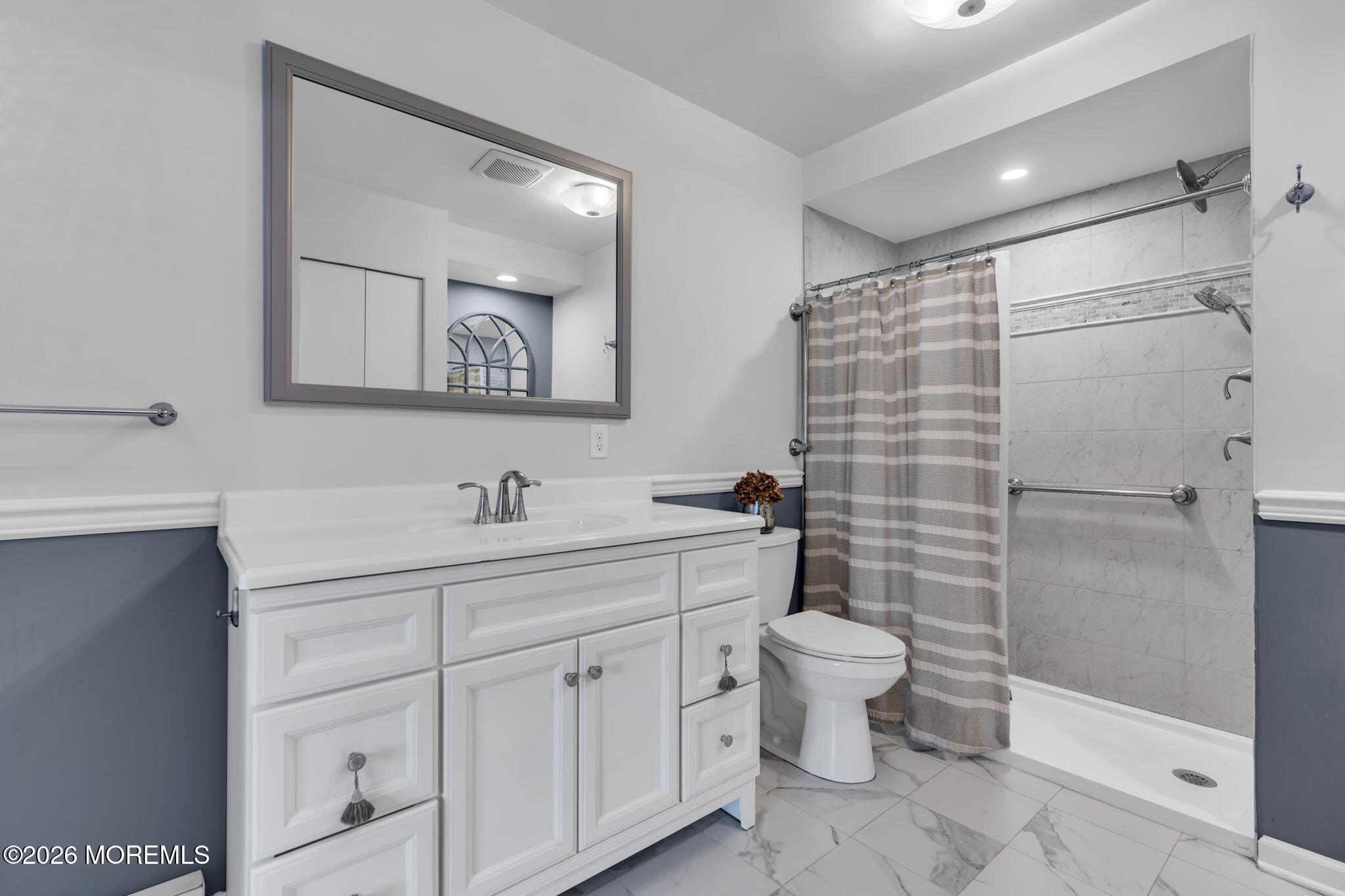 8 Manchester Court Red Bank, NJ 07701 - Photo 19 of 20 a bathroom with a toilet sink and mirror