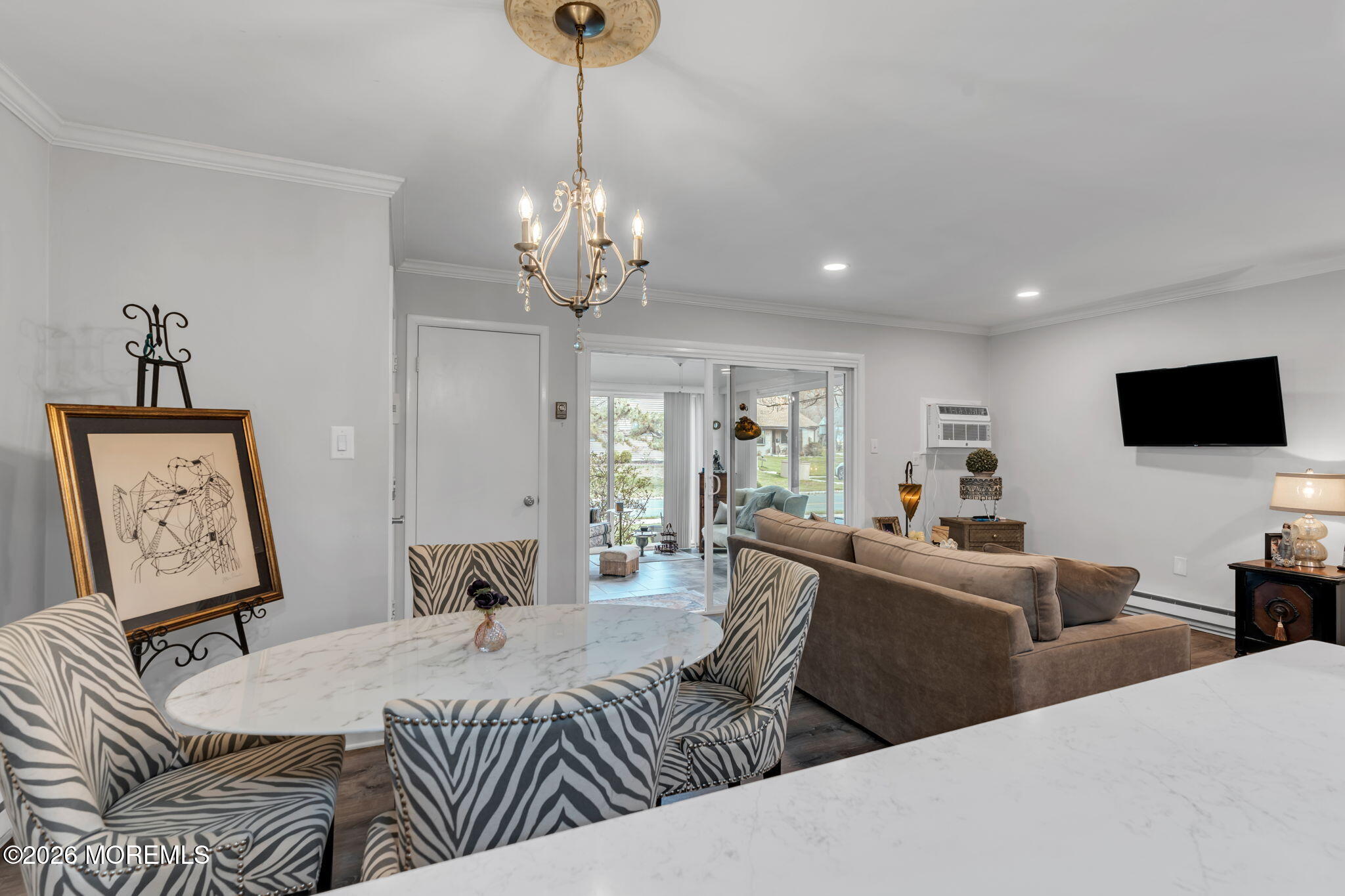 8 Manchester Court Red Bank, NJ 07701 - Photo 9 of 20 a bedroom with a bed and a chandelier