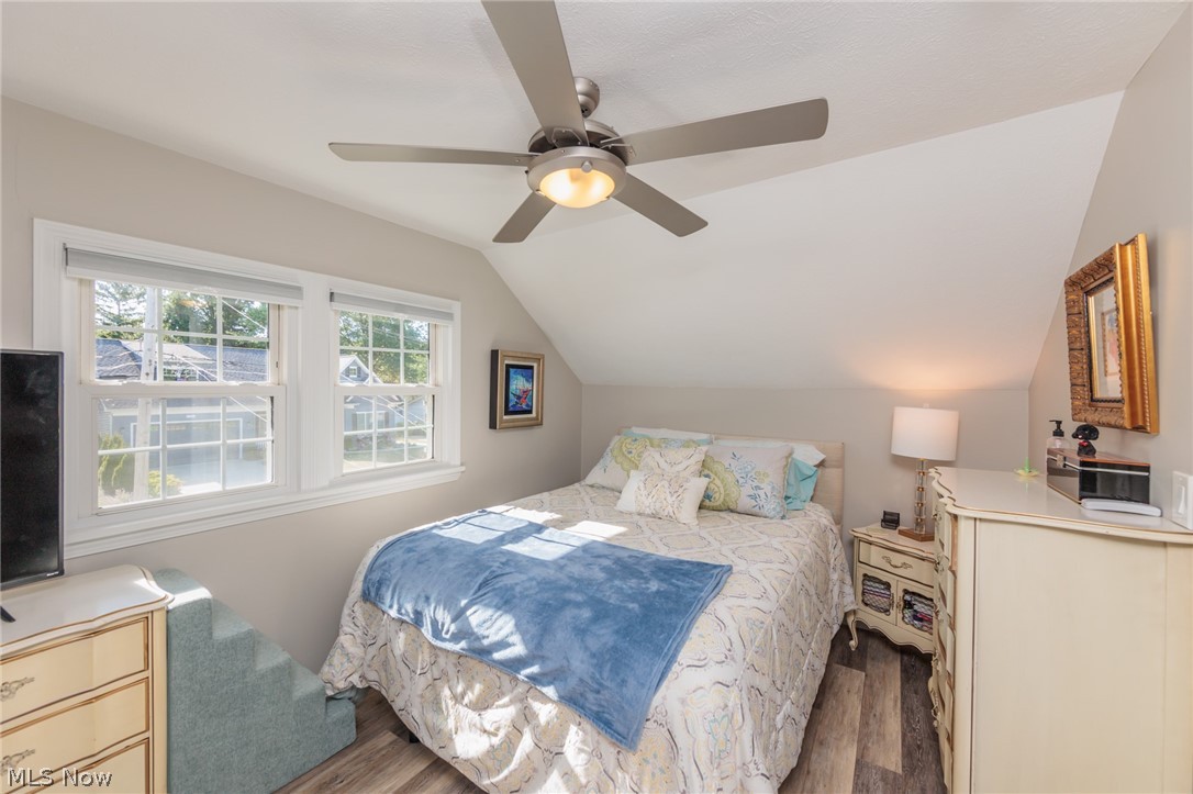 120 Sunset Road Avon Lake, OH 44012 - Photo 20 of 40 Bedroom featuring wood-type flooring, vaulted ceiling, and ceiling fan