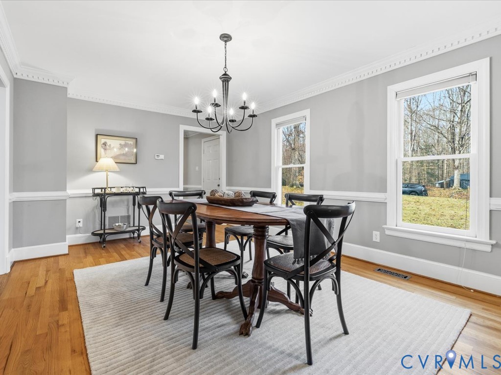 10221 North Donegal Road Chesterfield, VA 23832 - Photo 20 of 41 a view of a dining room with furniture window and wooden floor