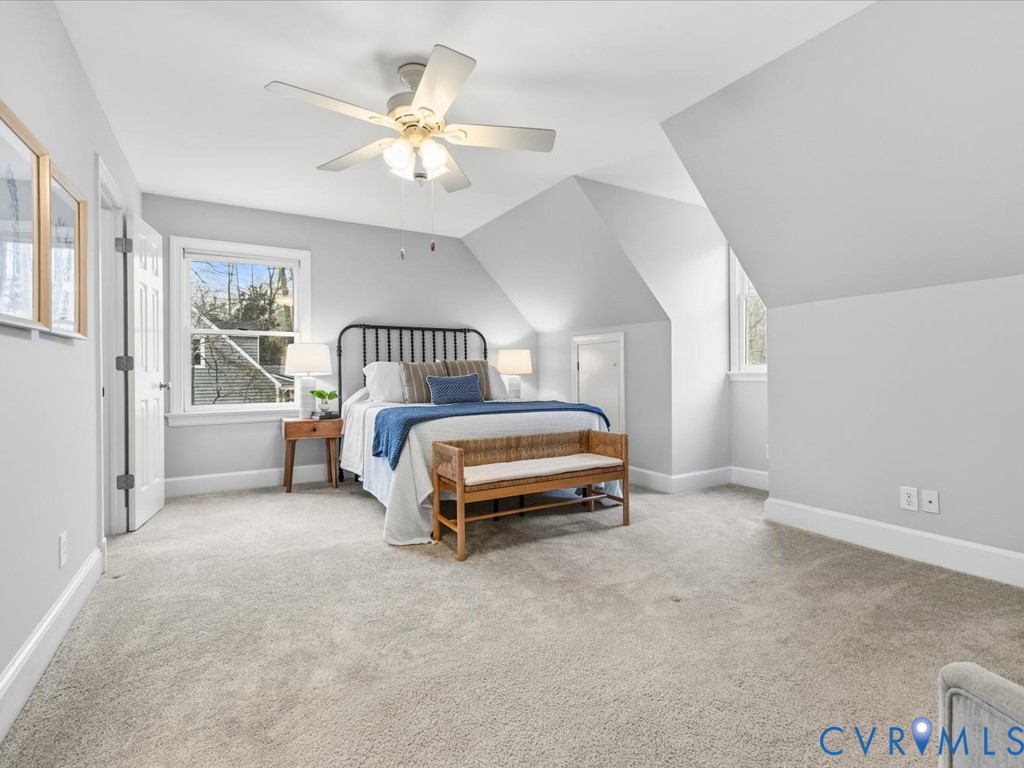 10221 North Donegal Road Chesterfield, VA 23832 - Photo 21 of 41 a bedroom with furniture and a chandelier