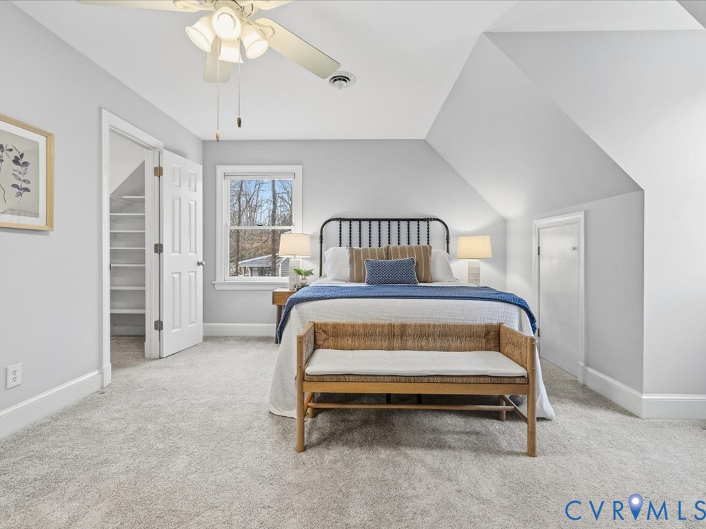 10221 North Donegal Road Chesterfield, VA 23832 - Photo 22 of 41 a bedroom with a bed and a chandelier