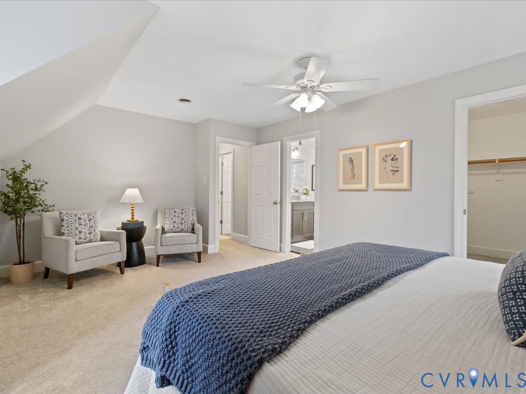 10221 North Donegal Road Chesterfield, VA 23832 - Photo 23 of 41 a bedroom with a bed and a chandelier