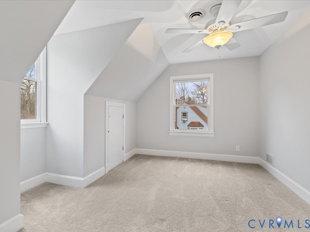 10221 North Donegal Road Chesterfield, VA 23832 - Photo 27 of 41 an empty room with a window and couch