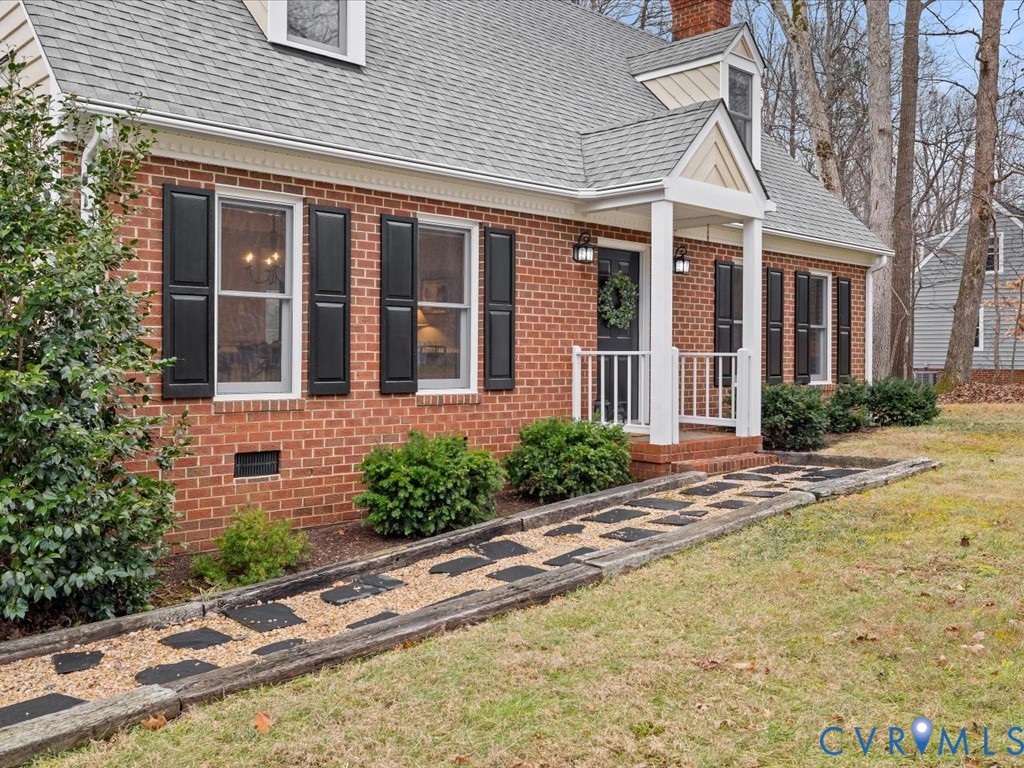 10221 North Donegal Road Chesterfield, VA 23832 - Photo 39 of 41 front view of a brick house with a yard