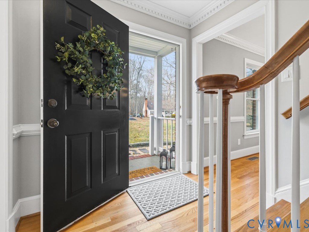 10221 North Donegal Road Chesterfield, VA 23832 - Photo 4 of 41 a view of a porch with a table and chairs