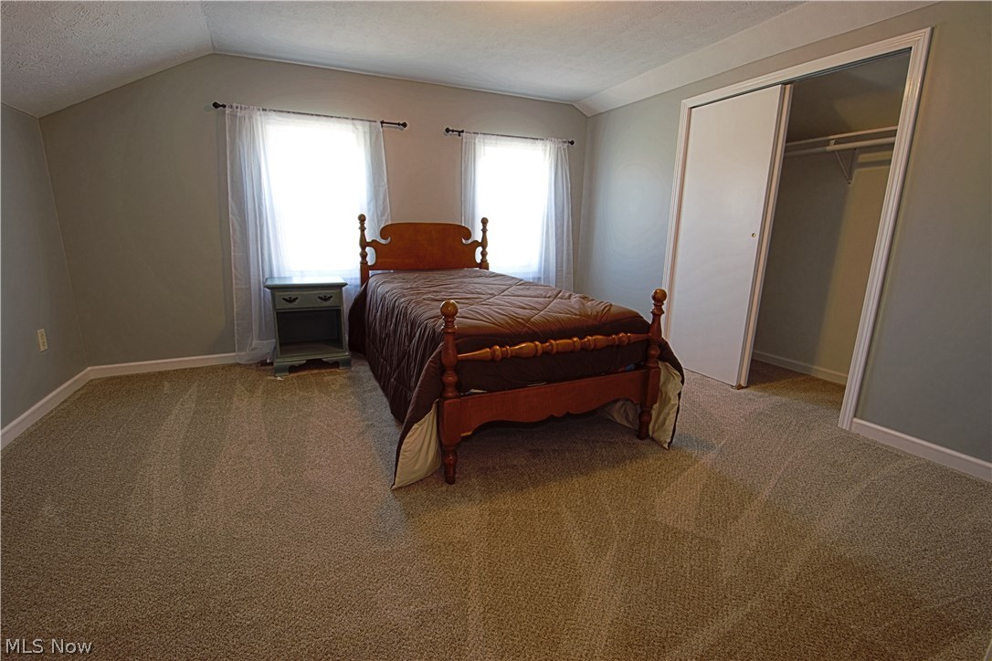 7670 Dewey Road Thompson, OH 44086 - Photo 25 of 34 3rd bedroom with full wall length closet for storage.