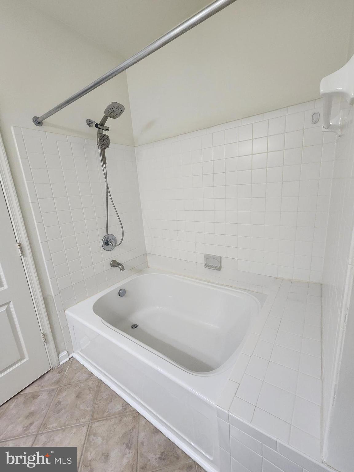 556 Rhapsody Court Hunt Valley, MD 21030 - Photo 29 of 38 a white bath tub sitting next to a shower