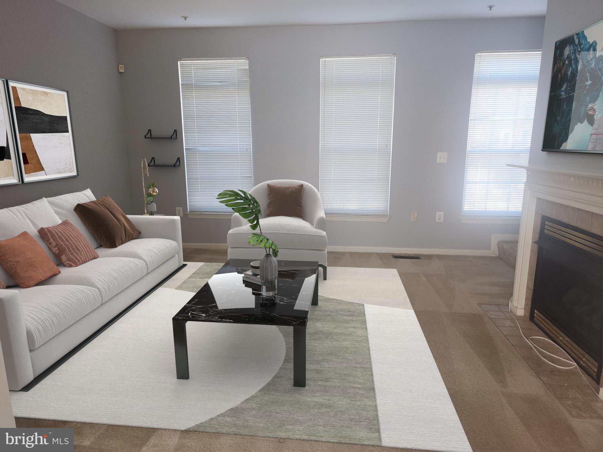 556 Rhapsody Court Hunt Valley, MD 21030 - Photo 6 of 38 a living room with furniture and a fireplace