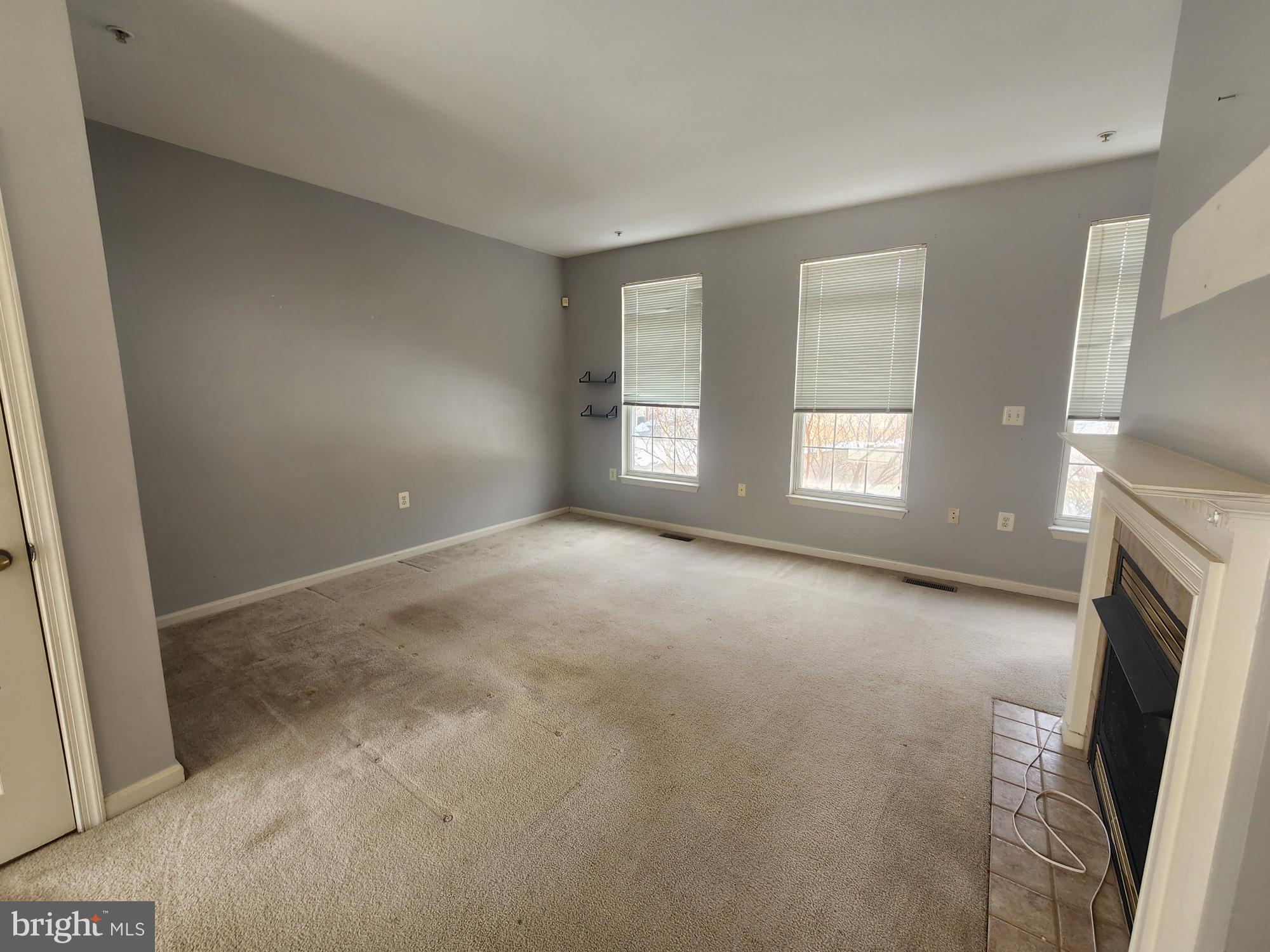 556 Rhapsody Court Hunt Valley, MD 21030 - Photo 7 of 38 a view of empty room with window and fireplace