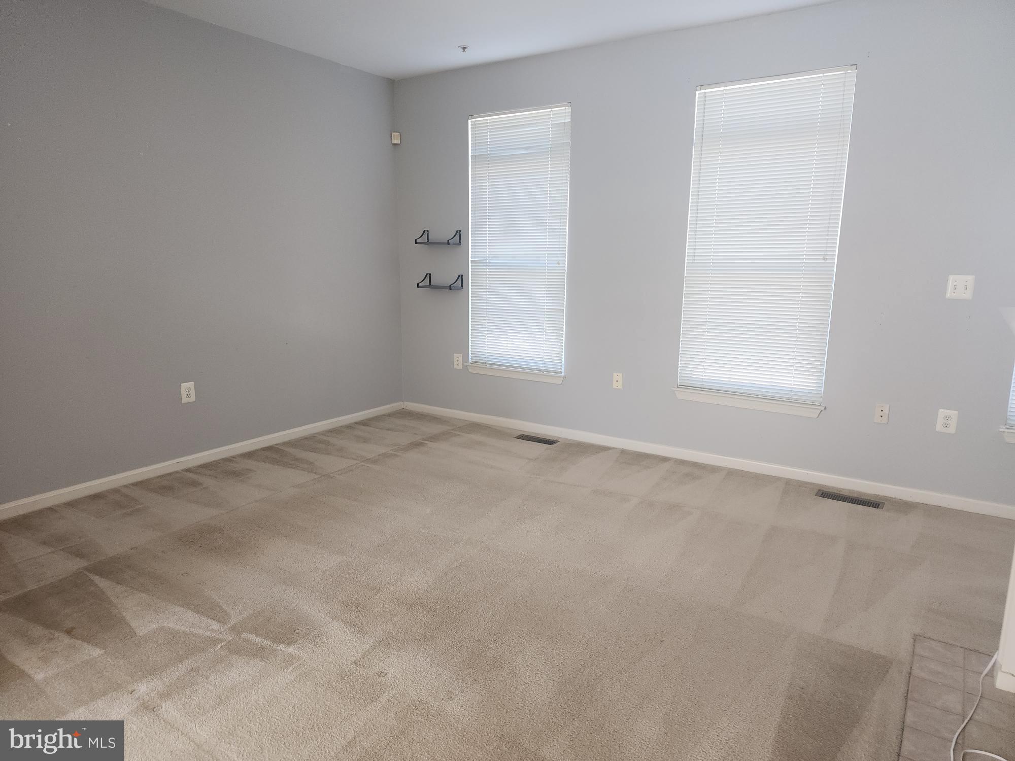 556 Rhapsody Court Hunt Valley, MD 21030 - Photo 9 of 38 an empty room with windows and closet