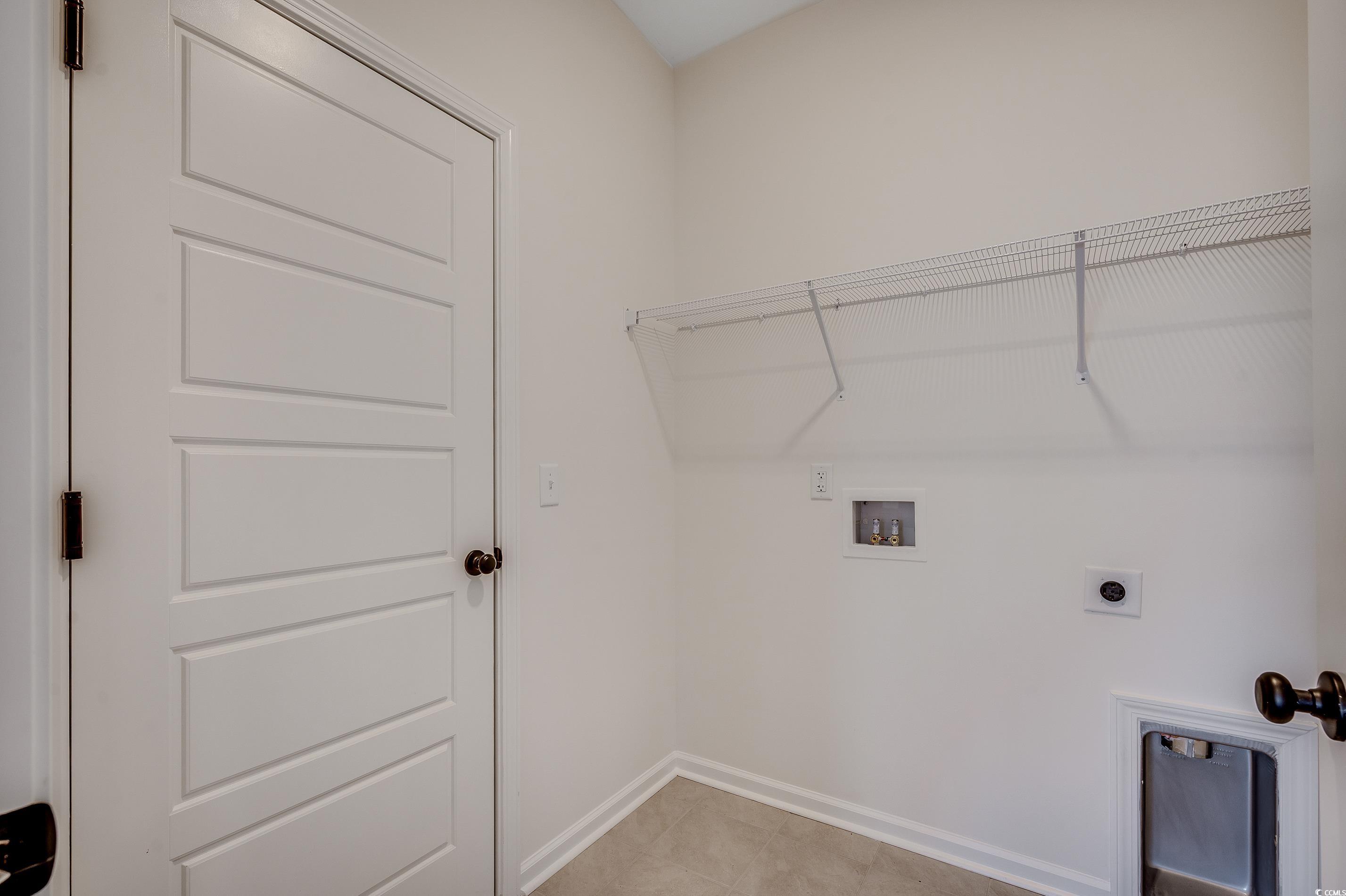 Tbd Anna Marie Way Murrells Inlet, SC 29576 - Photo 13 of 25 Laundry room featuring hookup for a washing machine, hookup for an electric dryer, and light tile patterned flooring