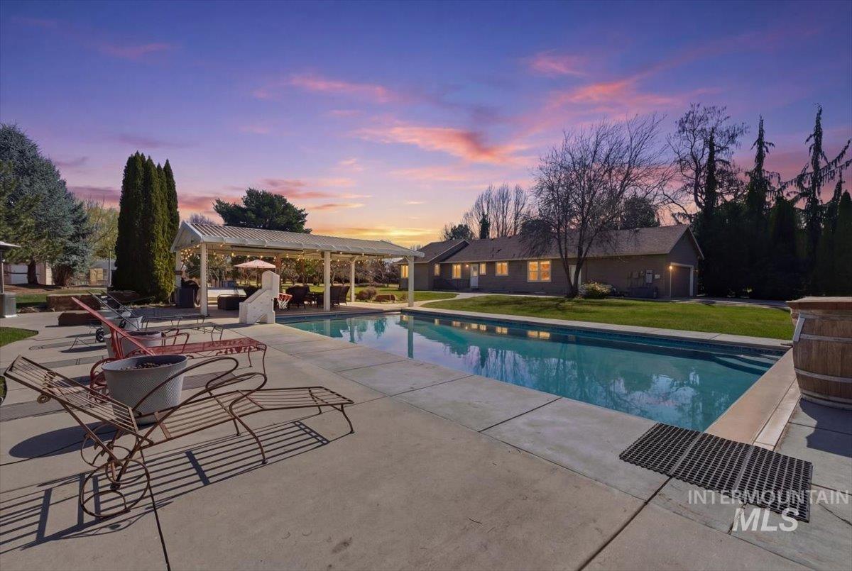 264 West Rush Court Eagle, ID 83616 - Photo 2 of 46 Swimming pool featuring a patio, a pergola, and a yard