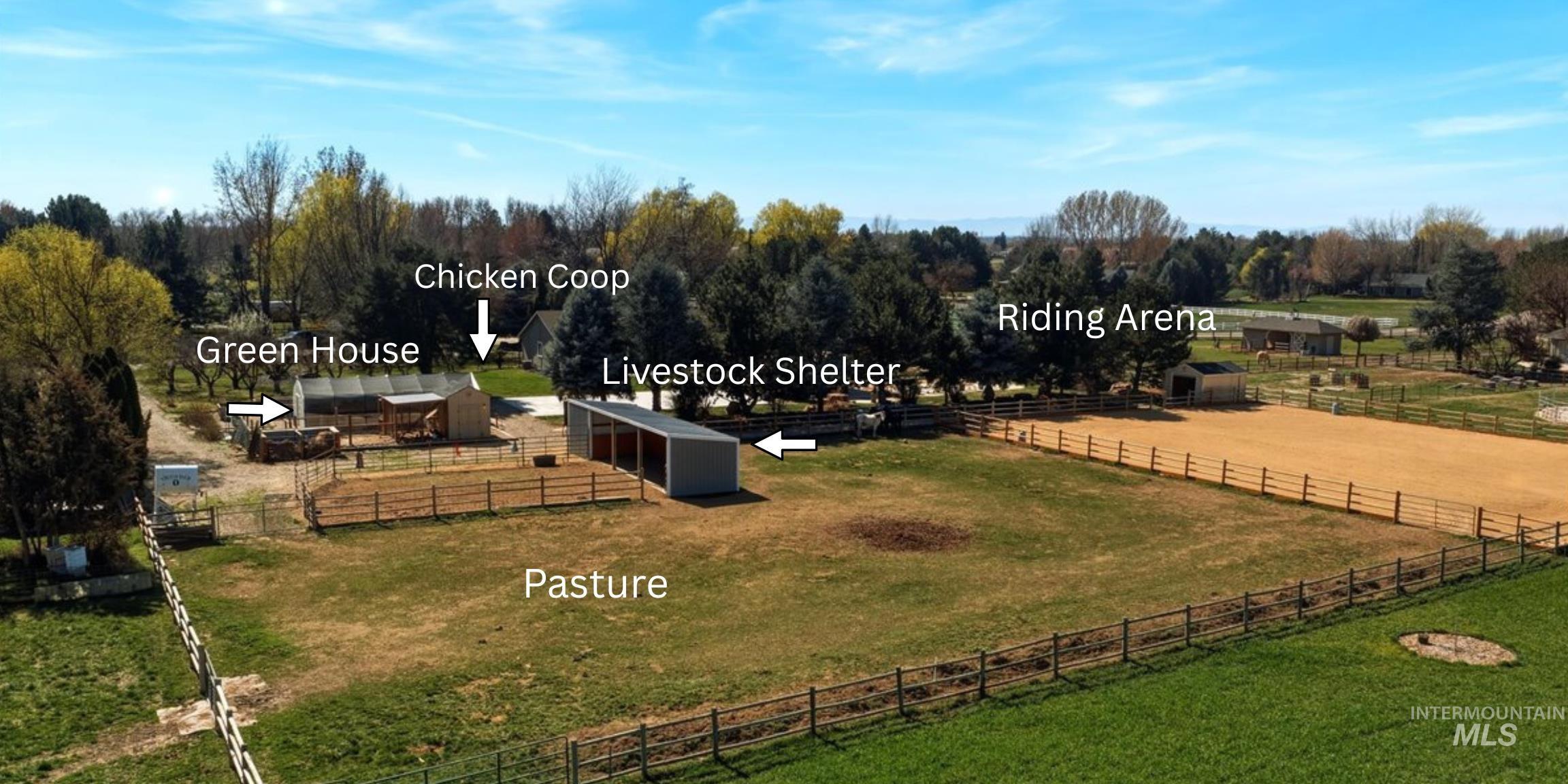 264 West Rush Court Eagle, ID 83616 - Photo 44 of 46 View of yard featuring an outbuilding, a view of countryside, an enclosed riding area, and a patio area