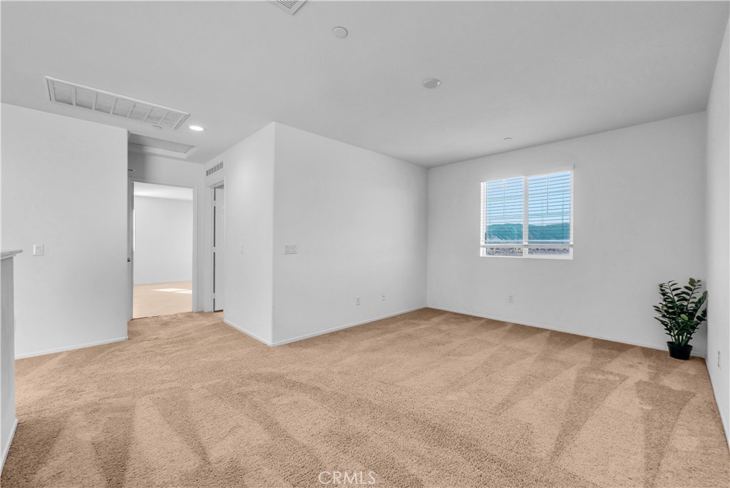 29157 Sunforest Lake Elsinore, CA 92530 - Photo 19 of 39 a view of an empty room with a window