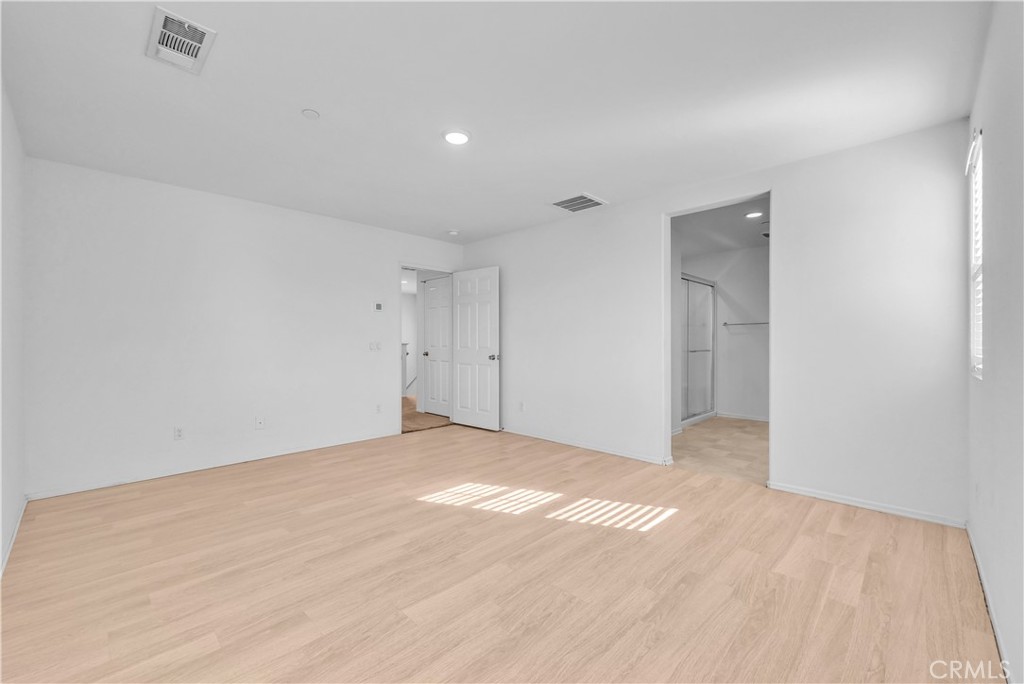 29157 Sunforest Lake Elsinore, CA 92530 - Photo 23 of 39 a view of an empty room and wooden floor