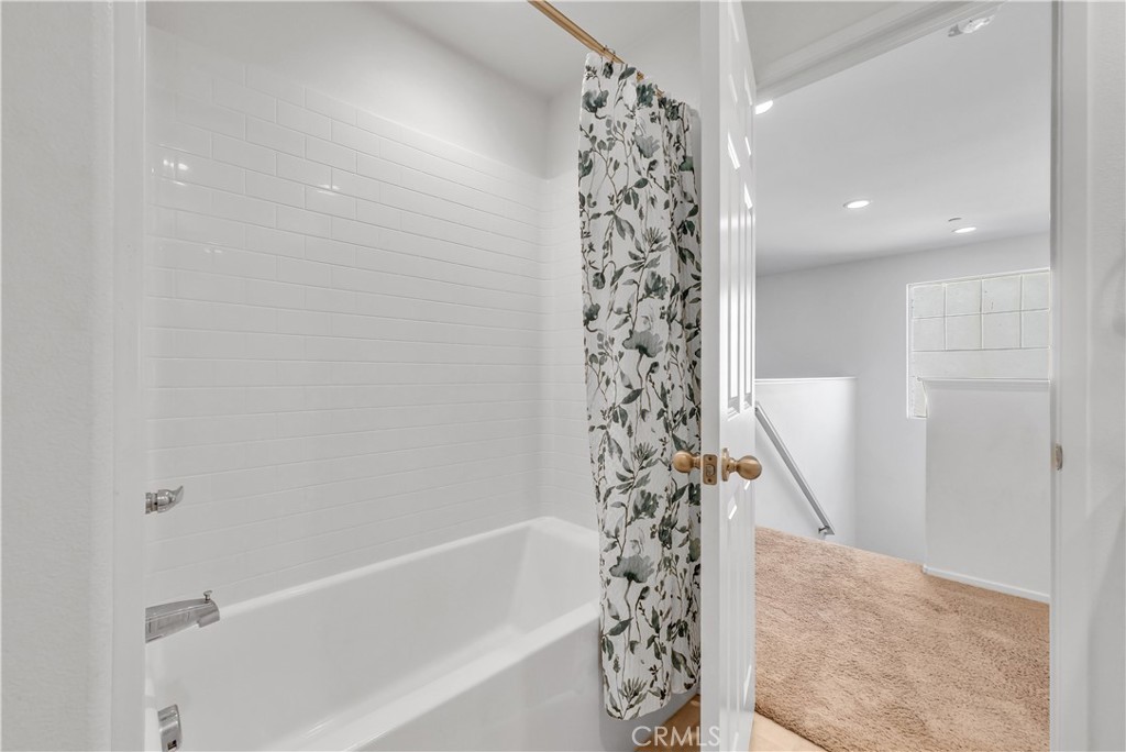 29157 Sunforest Lake Elsinore, CA 92530 - Photo 32 of 39 a bathroom with a bathtub and shower