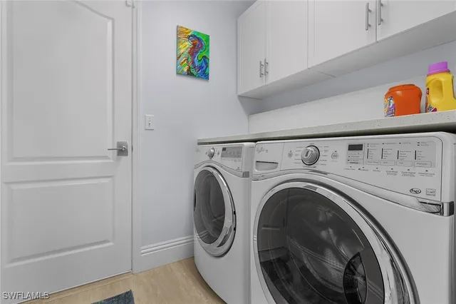 a bedroom with a bed and a lamp