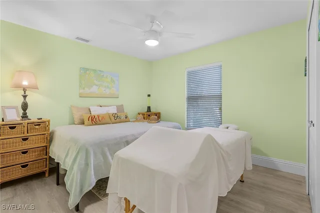 a bedroom with a bed and a tv