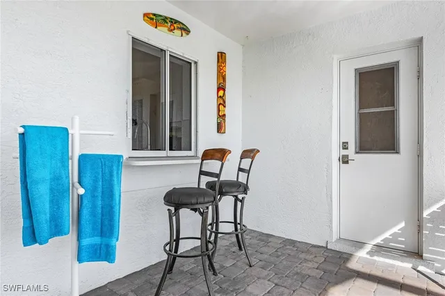 an aerial view of residential houses with outdoor space and lake view