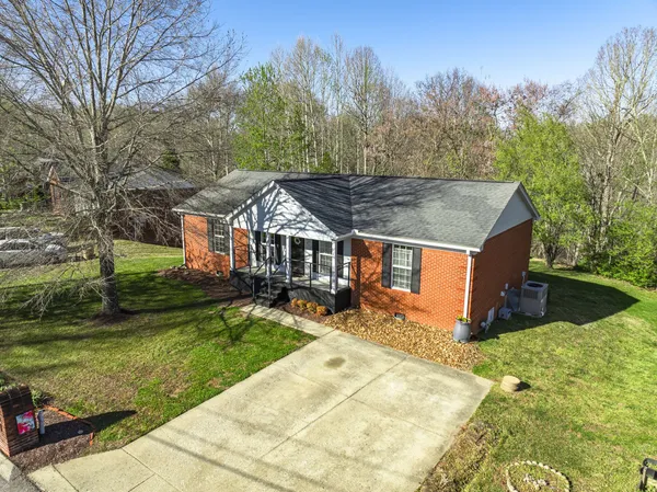front view of a house with a yard