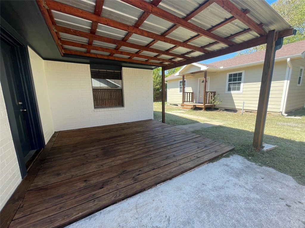 1303 Pendergrass Street Lockhart, TX 78644 - Photo 14 of 16 a view of an empty room with wooden floor and a window