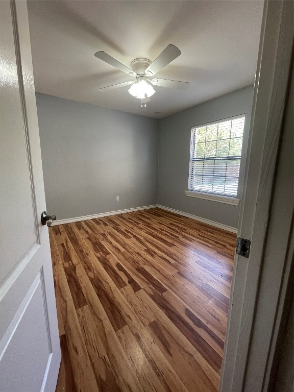 1303 Pendergrass Street Lockhart, TX 78644 - Photo 4 of 16 a bedroom with a bed and a window