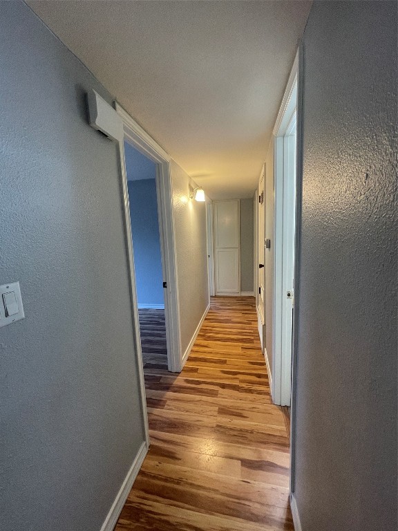 1303 Pendergrass Street Lockhart, TX 78644 - Photo 5 of 16 a view of a hallway with wooden floor and stairs