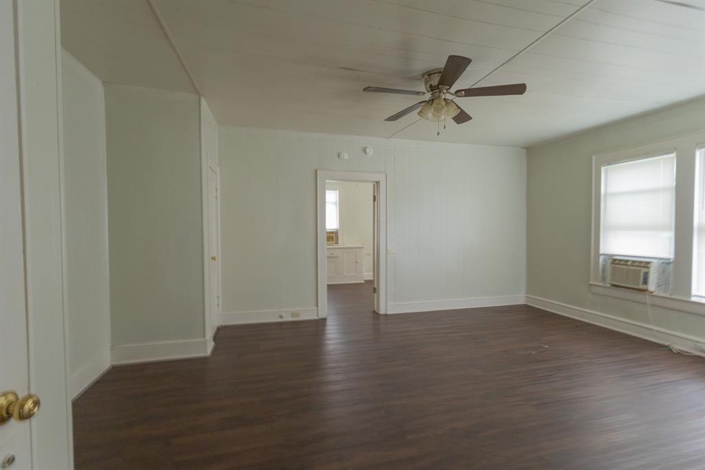 2913 Homan Avenue, Unit 2913 Waco, TX 76707 - Photo 10 of 16 Spacious interior room featuring wood-finish flooring, light-colored walls, and a ceiling fan